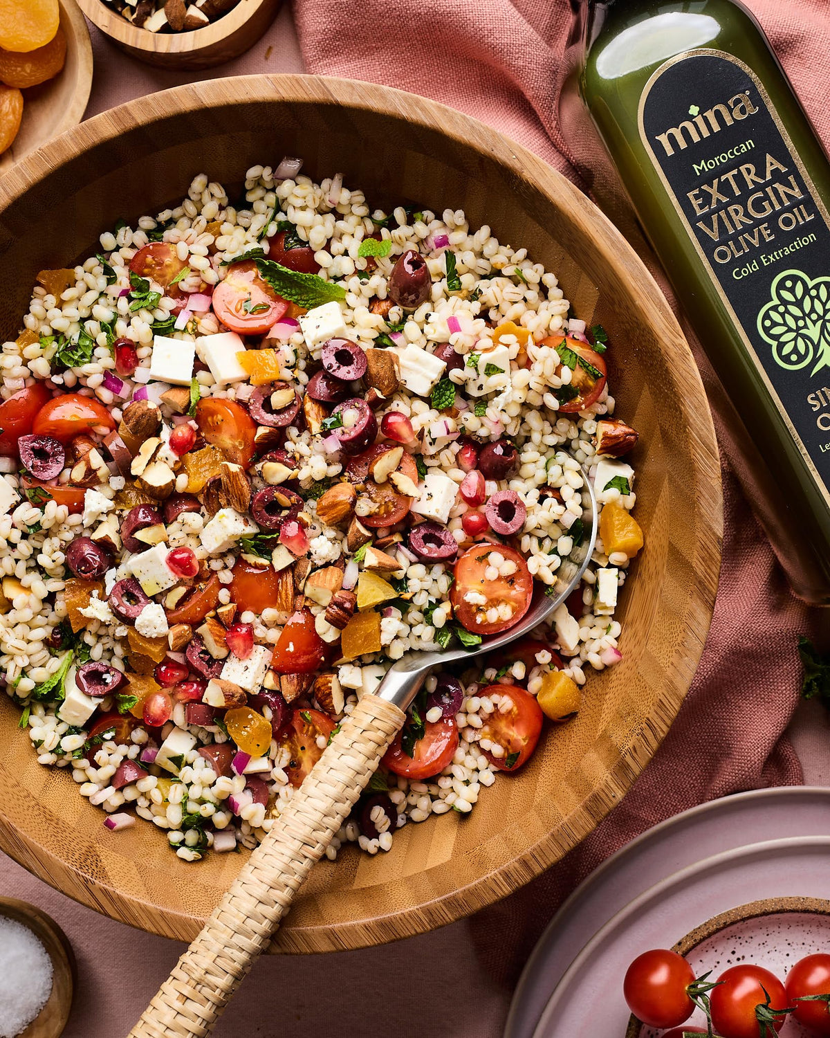 Mina olive oil in a bright kitchen scene, versatile for cooking.