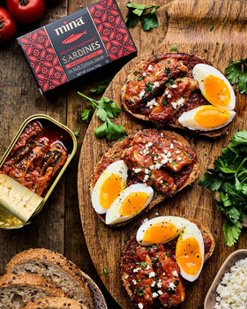 Mina Sardines hand-packed can, artisanal texture for premium flavor.
