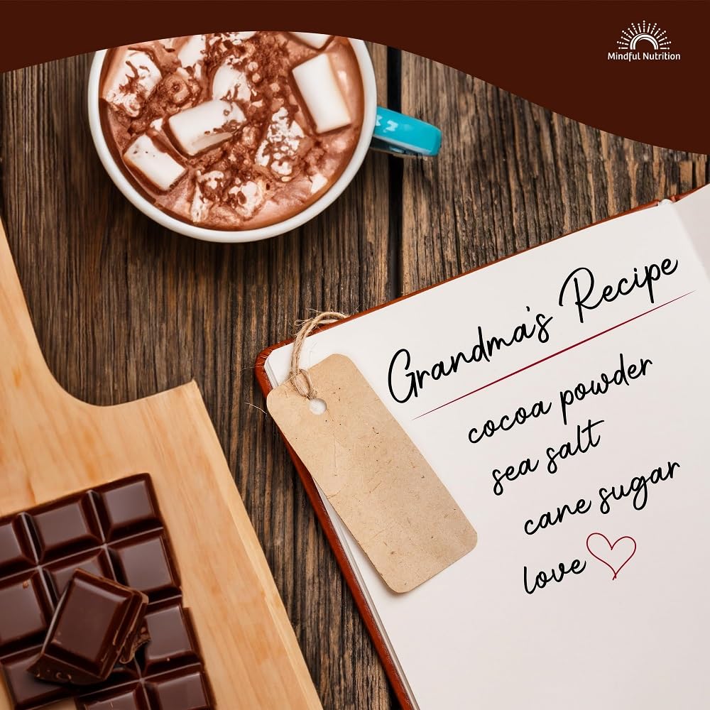 Mindful Nutrition Grandmas hot chocolate cup steaming with milk.