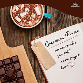 Mindful Nutrition Grandmas hot chocolate cup steaming with milk.
