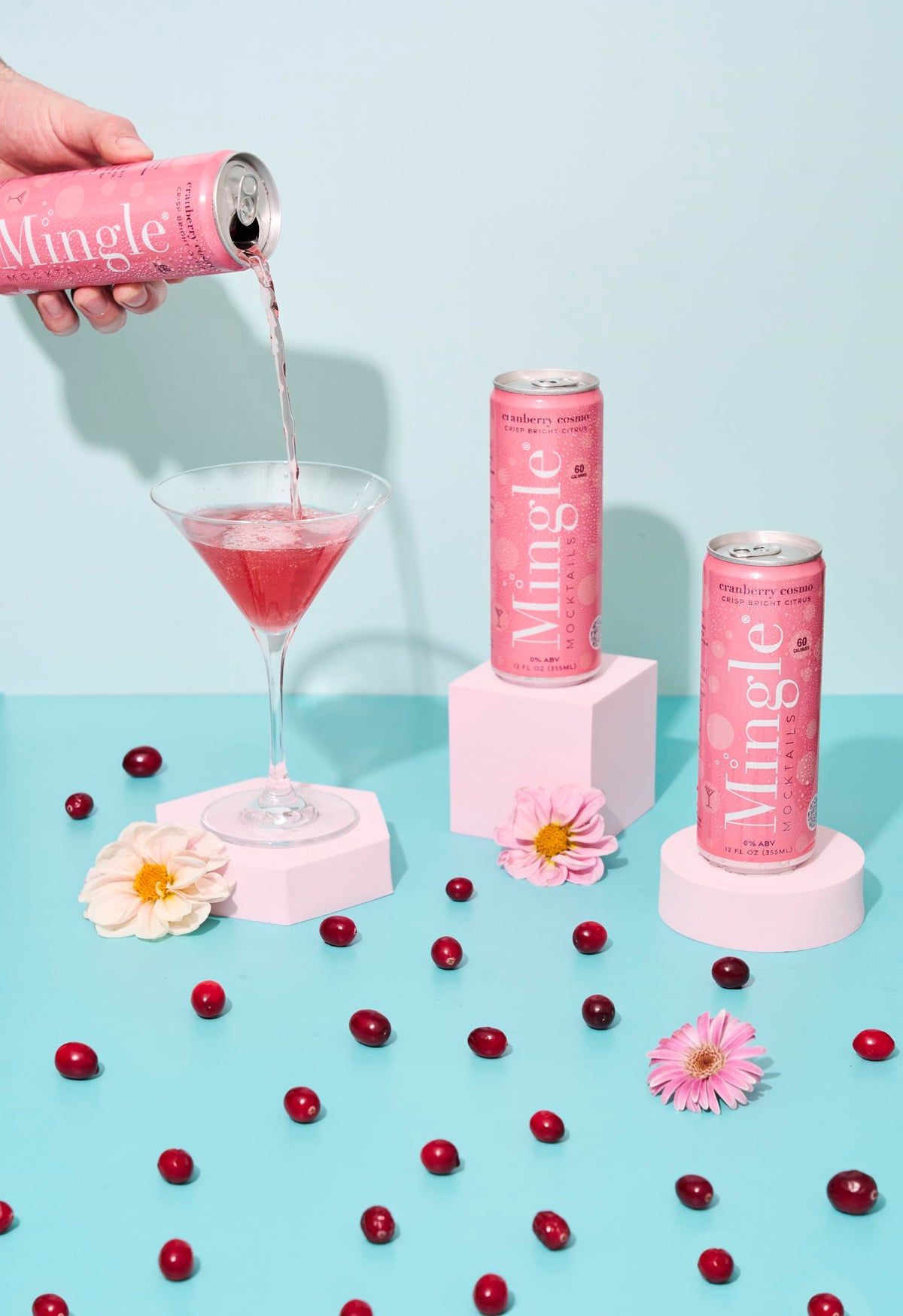 Chilled Mingle Cranberry Cosmo can on a party table, perfect for gatherings
