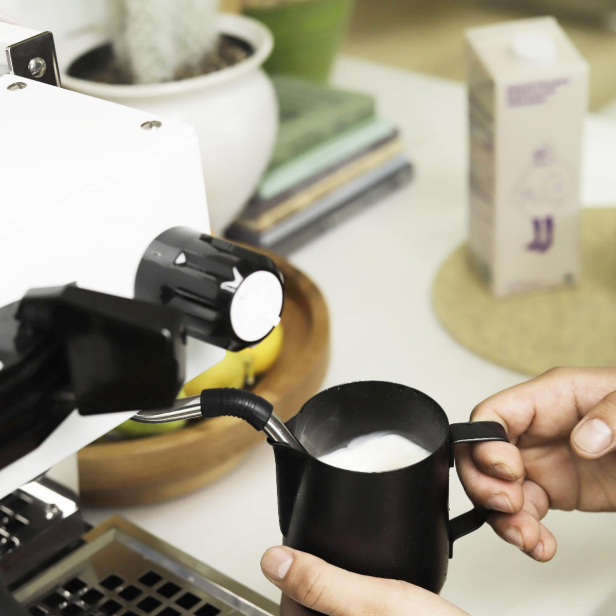 Minor Figures Barista Oat Milk pouring espresso shows smooth pour and crema potential.