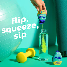 Mio Sport Lemon Lime active user preparing a citrus-flavored drink during a workout.