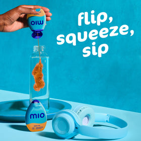 Hand holding Mio Sweet Tea bottle for quick flavor boost