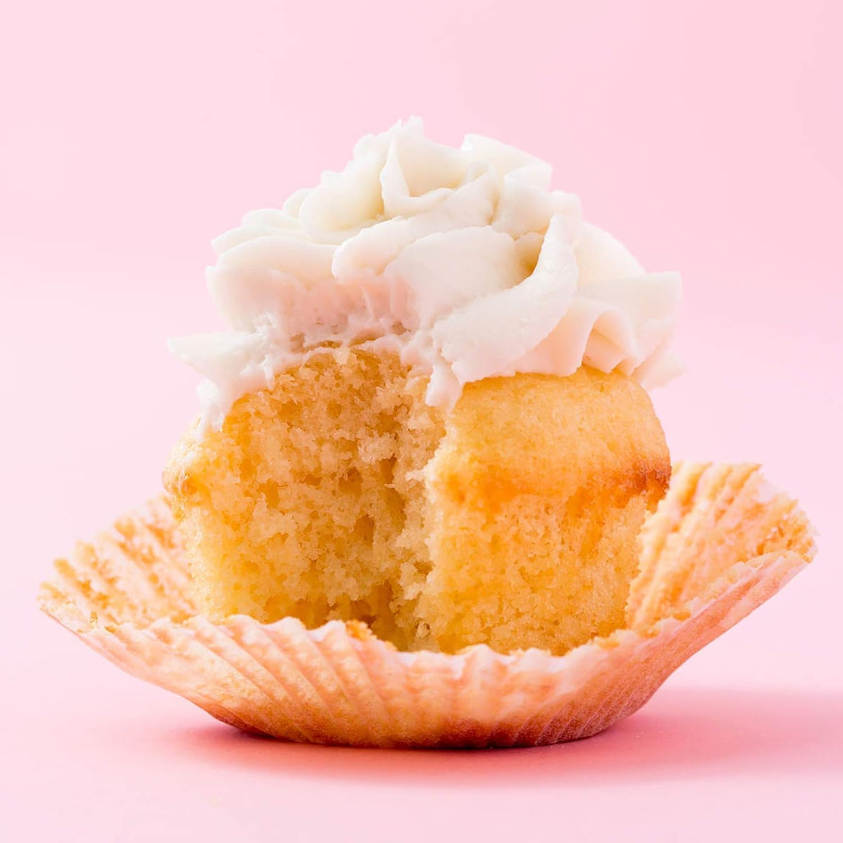 Miss Jones Baking Organic Vanilla Buttercream Frosting swirl atop cupcakes for quick elegant decorating.