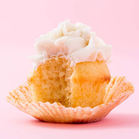 Miss Jones Baking Organic Vanilla Buttercream Frosting swirl atop cupcakes for quick elegant decorating.