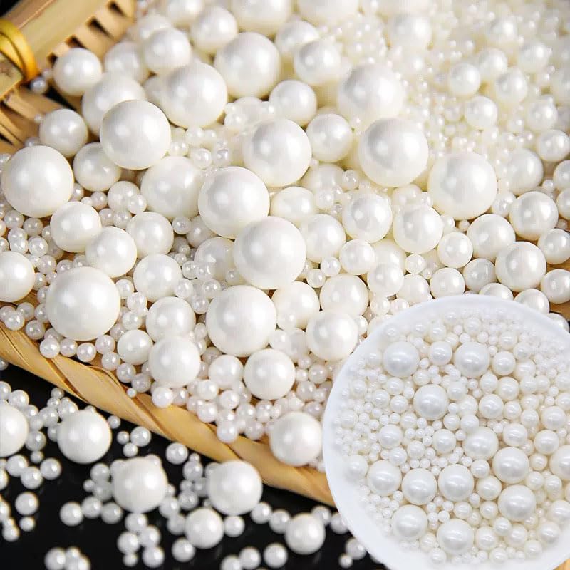 Mkostlich white pearl sprinkles on cake for elegant, crunchy decoration.