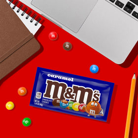 Colorful M&M'S caramel chocolates in a gift bag for celebrations.