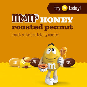 M&M'S Honey Roasted Peanut Milk Chocolate closeup showing creamy chocolate and peanuts.