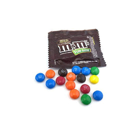 M&amp;M's Milk Chocolate Fun Size closeup shows crisp shell and creamy center