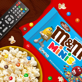 Gingerbread house decorated with M&M'S MINIS for playful details.