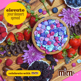M&M'S WORLD candy-bar dessert table setup with vibrant candy bars.