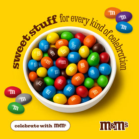 M&M’S WORLD White Peanut Chocolate Candy dessert table display with festive appeal.