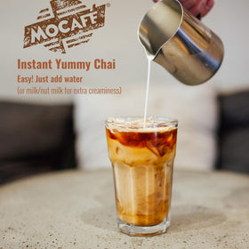 MOCAFÉ Spiced Chai Latte Powder served in a steaming cup for comforting hot chai.