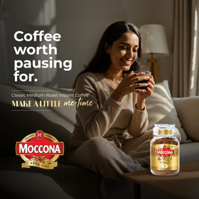 Moccona Cup of coffee with steam conveys warmth and consistent quality