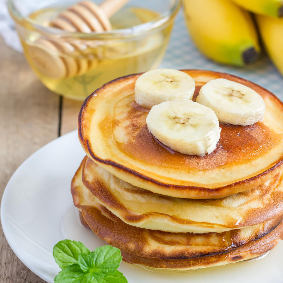 Plate of Mochi Foods banana macadamia pancakes showing chewy-fluffy texture.