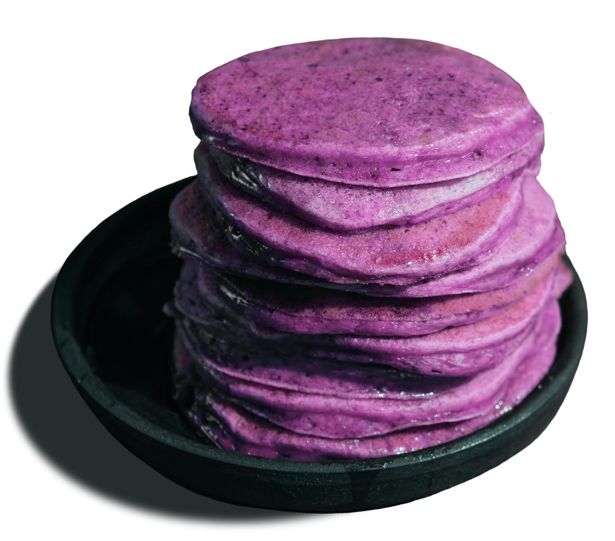 Mochi Foods Ube Pancake Mix served with golden waffles on plate.