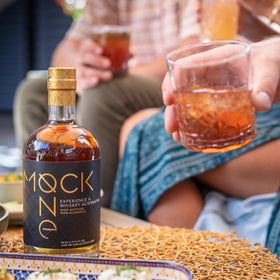 Zero-proof whiskey mocktail idea starring Mock One with citrus.