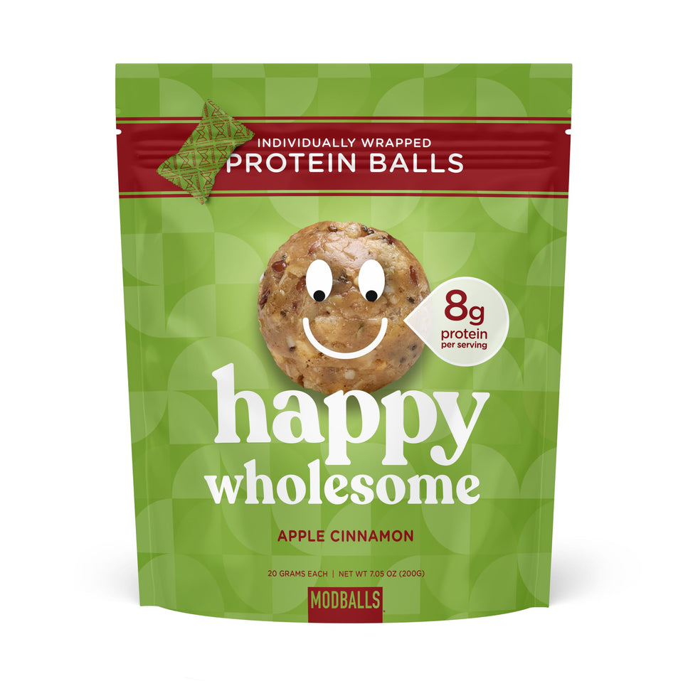 ModBalls Happy Wholesome Apple Cinnamon protein balls in a bag, convenient snack for busy days.
