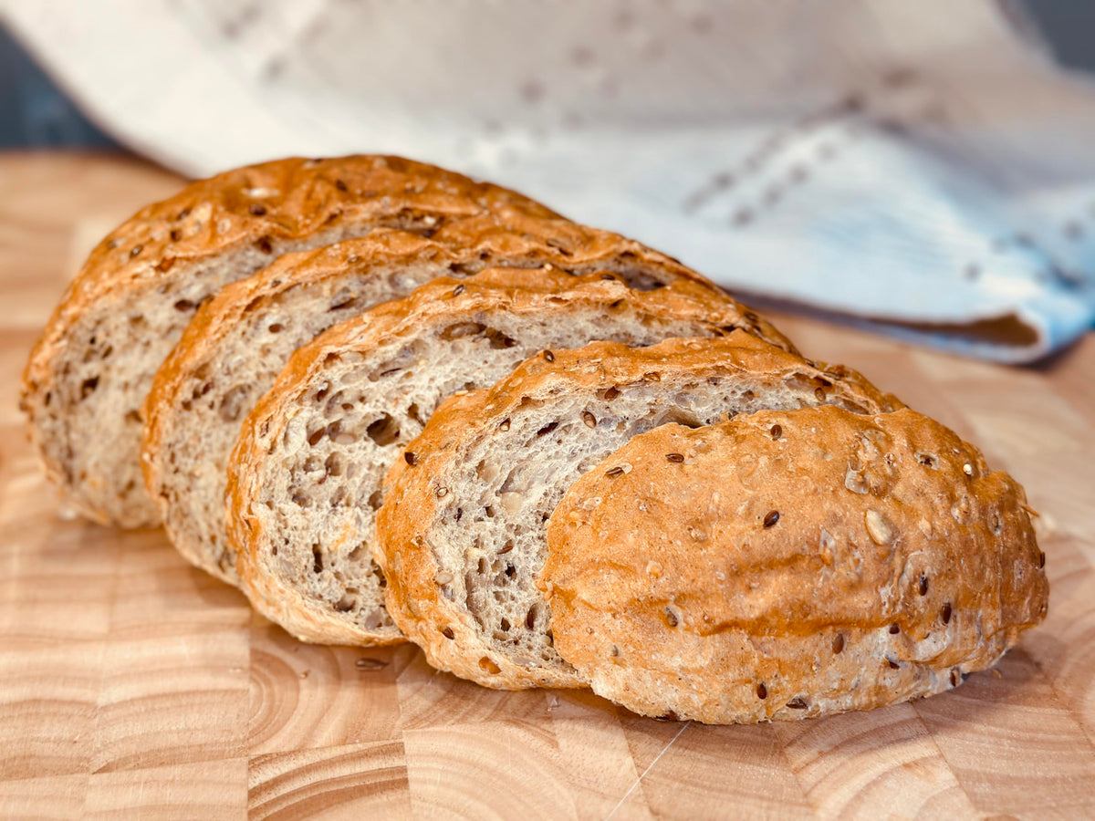 Molibake 8 Grain sliced loaf on cutting board ready to serve.