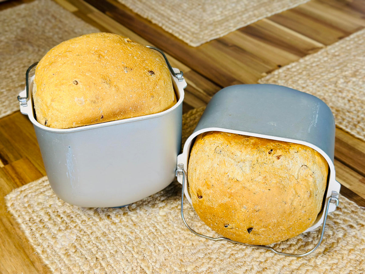 Baked Molibake focaccia on a sheet with a golden, crisp crust.