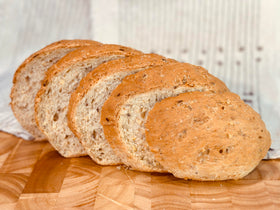 Molibake Onion Bread Mix dried onion flakes closeup emphasizes savory aroma in loaves.
