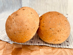 Molibake Onion Bread Mix kitchen scene with loaf on cutting board for family meals.