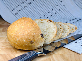 Molibake focaccia served with pasta and salad for versatile meals.