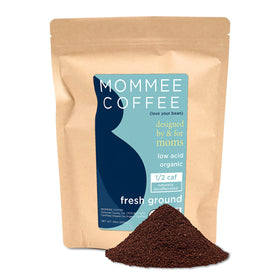 Mommee Coffee Half Caf packaging shows organic, fair-trade beans for a responsible brew.