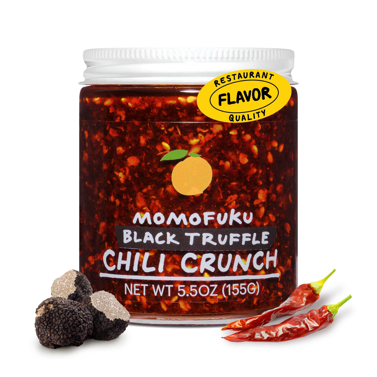 MOMOFUKU Black Truffle Chili Crunch bottle pour for bold flavor enhancement.