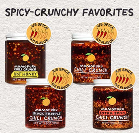 Momofuku Chili Crunch ingredients close-up with peppers and aromatics.
