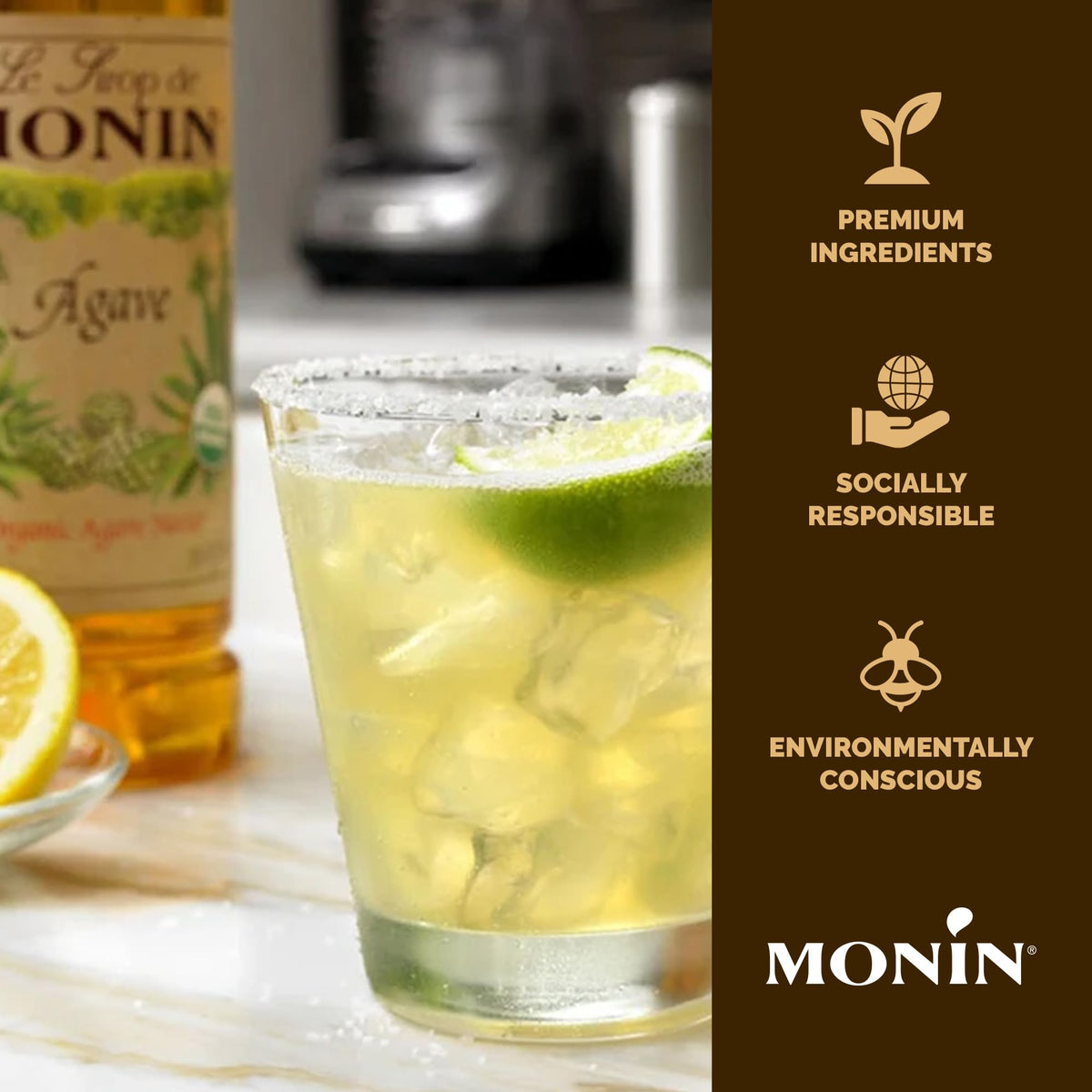 Monin Agave Syrup glass with beverage, illustrating versatile use in tea and cocktails.