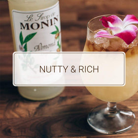 Monin Almond Syrup cocktail setup with shaker suggesting nutty flavor complexity