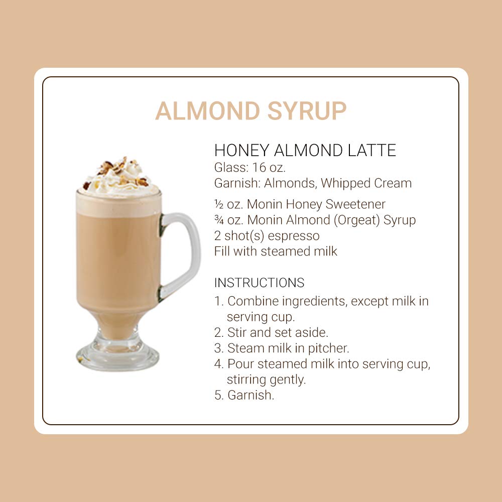 Monin Almond Syrup in glass with coffee steam rising
