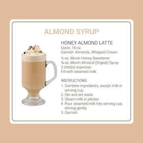 Monin Almond Syrup in glass with coffee steam rising