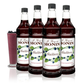 Monin Blackberry Syrup bottle closeup with rich color for cocktails and drinks.