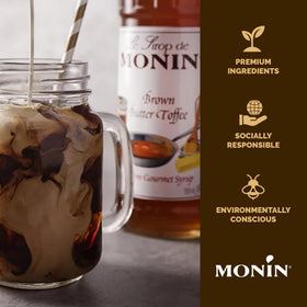 Monin Brown Butter Toffee Syrup bottle beside cocktail glass for dessert-inspired cocktails