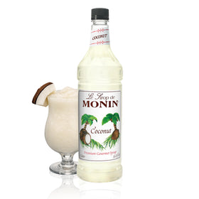 Monin Coconut Syrup bottle pouring, perfect for tropical cocktails and smoothies.