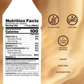 Monin Cookie Butter Syrup pouring into a latte for a rich, spiced flavor.