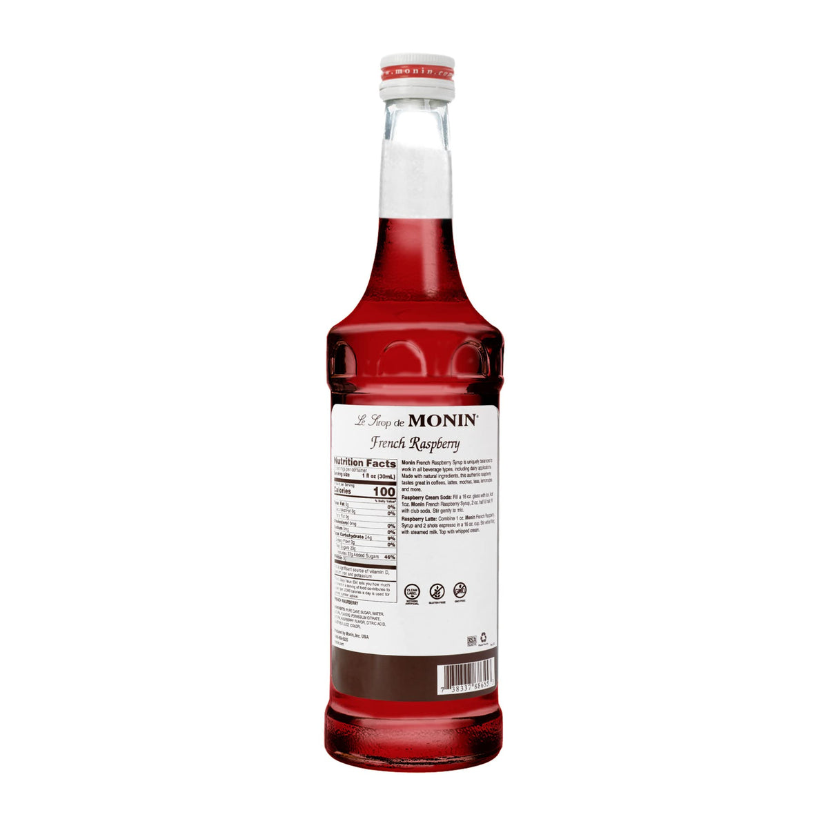 Monin French Raspberry Syrup pouring into a glass for lattes and iced cocktails.