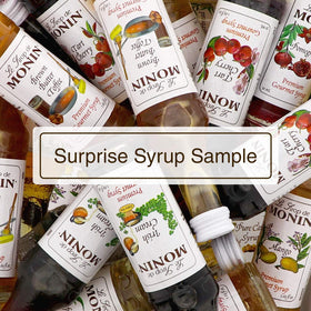 Monin Granny Smith Apple Syrup bottle over lemonades for bright flavor