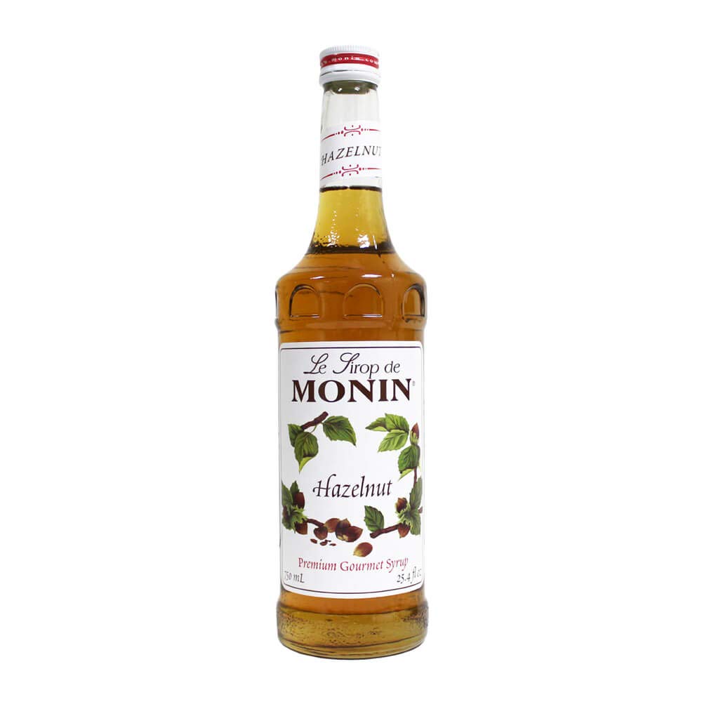 Monin hazelnut syrup bottle close-up for rich coffee and dessert flavor