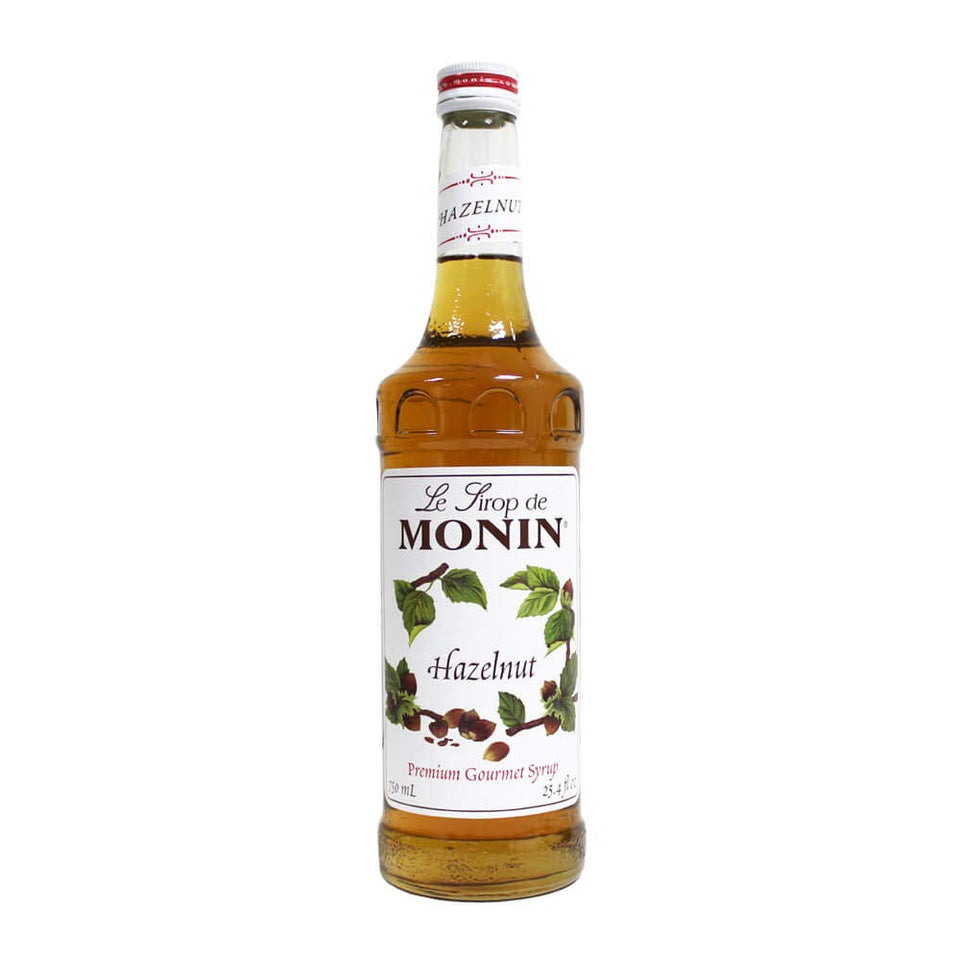 Monin hazelnut syrup bottle close-up for rich coffee and dessert flavor