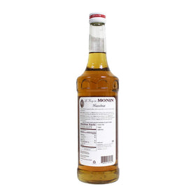 Monin hazelnut syrup bottle pour for lattes and desserts