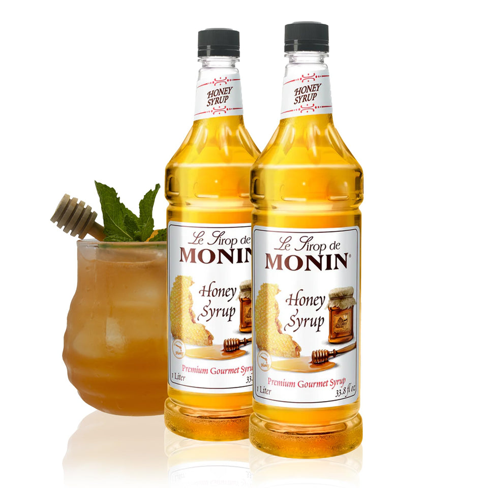 Monin Honey Syrup bottle pour, showcasing smooth honey flavor for drinks