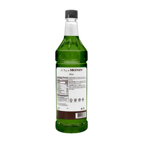 Monin Kiwi syrup bottle closeup, emphasizing rich flavor and kosher-quality branding for creative beverages.