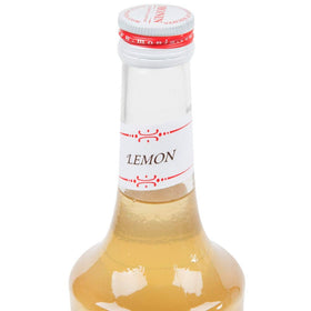 Monin Lemon Syrup served in a glass with fresh lemon for refreshing drinks
