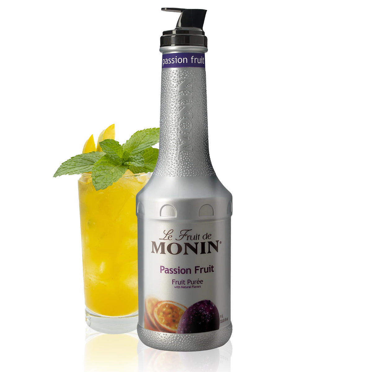 Monin Passion Fruit Puree bottle on a bar, boosting tropical cocktails with clean label flavor