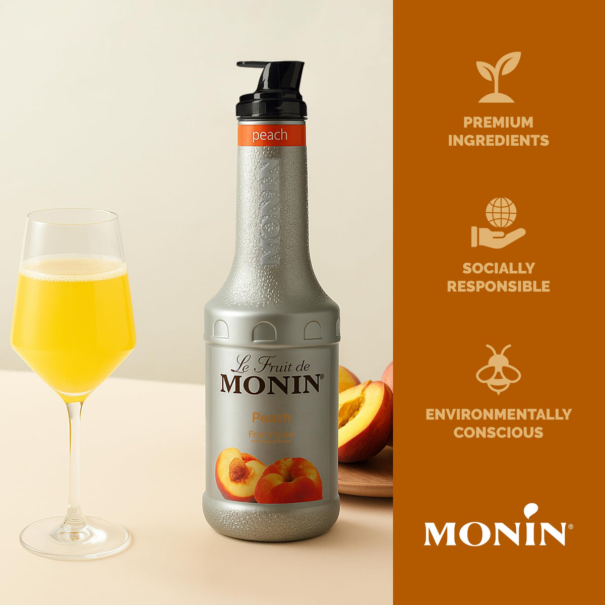 Monin Peach Purée bottle beside lemons for lemonade versatility