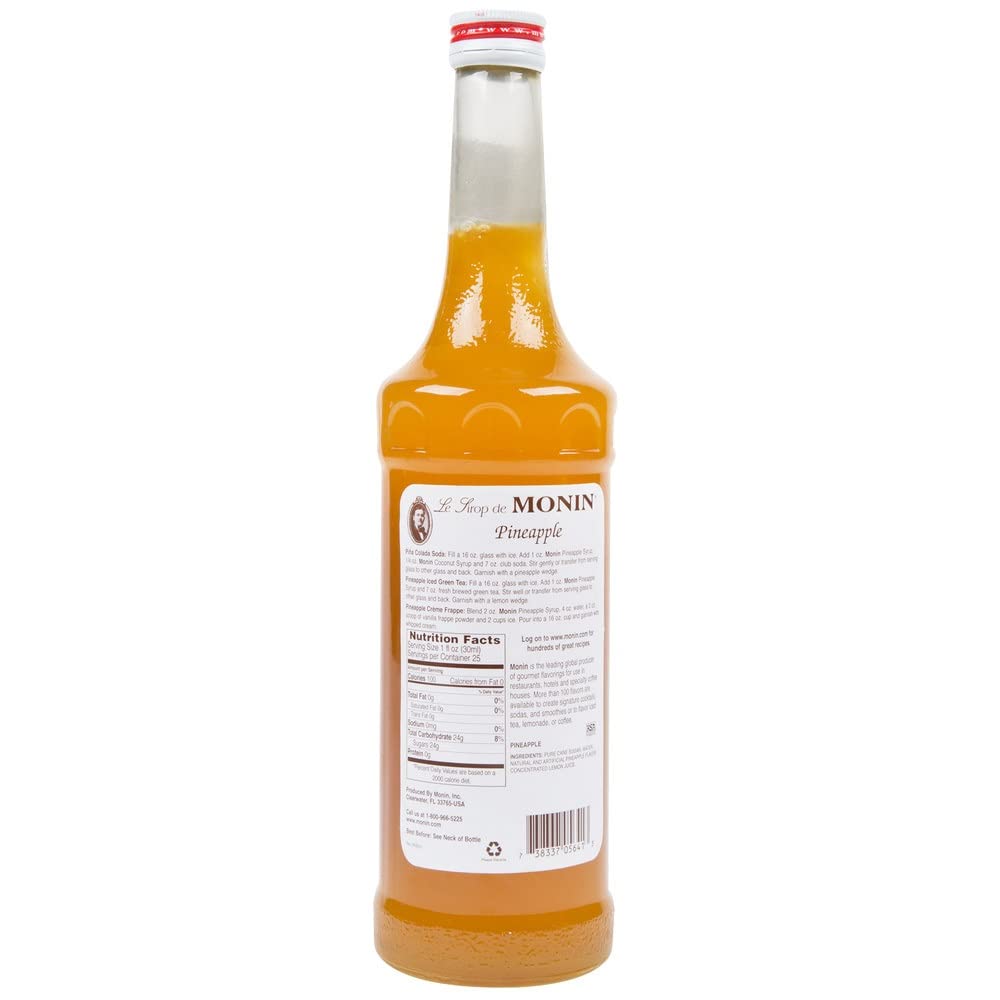 Pouring Monin Pineapple Syrup into a glass for drinks
